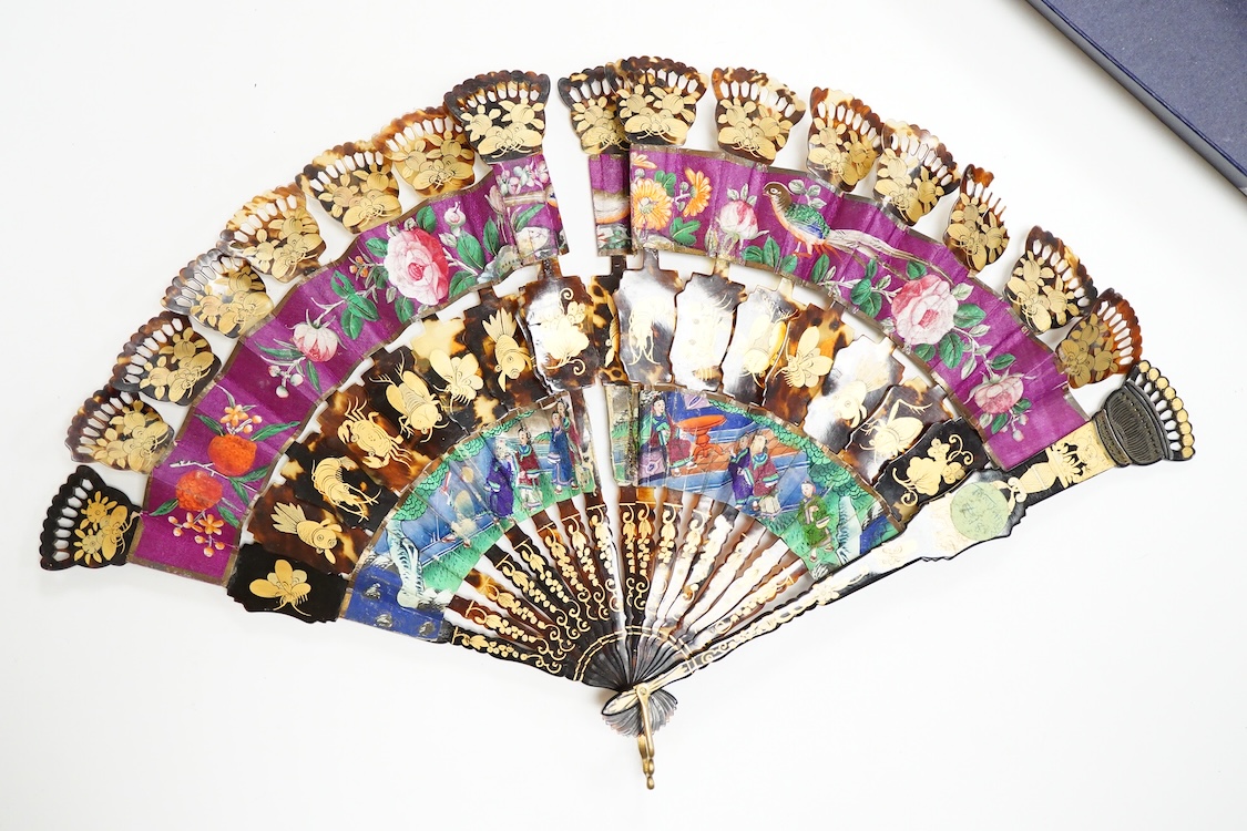 An unusual 19th century Chinese export gilt-decorated tortoiseshell and painted leaf fan, two English fans decorated with paper printed paper crests and a single sided Canton fan leaf lacking sticks, largest 23cm in leng